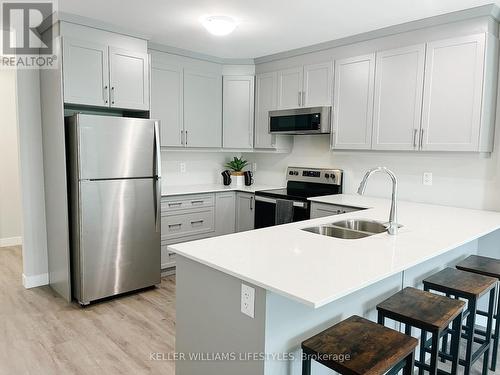 104 - 100 The Promenade Road, Central Elgin (Port Stanley), ON - Indoor Photo Showing Kitchen With Double Sink With Upgraded Kitchen