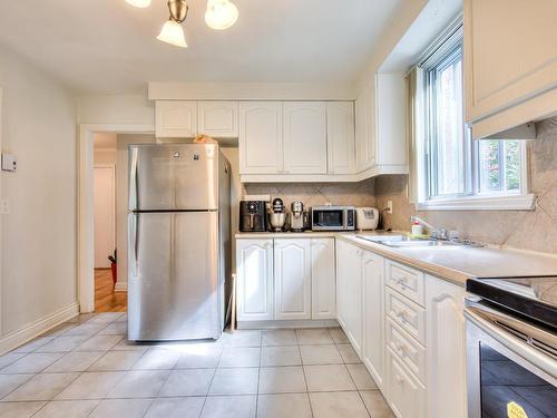 Cuisine - 5200  - 5202 Av. Prince-Of-Wales, Montréal (Côte-Des-Neiges/Notre-Dame-De-Grâce), QC - Indoor Photo Showing Kitchen With Double Sink