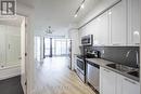 902 - 50 Bruyeres Mews, Toronto (Niagara), ON  - Indoor Photo Showing Kitchen With Double Sink With Upgraded Kitchen 