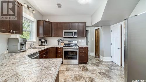 1314 3Rd Avenue Ne, Moose Jaw, SK - Indoor Photo Showing Kitchen With Double Sink