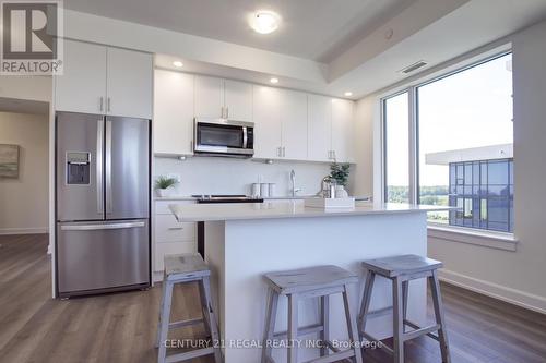 823 - 3200 William Coltson Avenue, Oakville, ON - Indoor Photo Showing Kitchen With Stainless Steel Kitchen