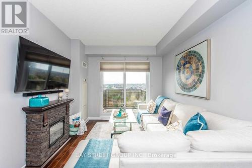 710 - 385 Prince Of Wales Drive, Mississauga (City Centre), ON - Indoor Photo Showing Living Room With Fireplace