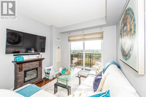 710 - 385 Prince Of Wales Drive, Mississauga, ON - Indoor Photo Showing Living Room With Fireplace