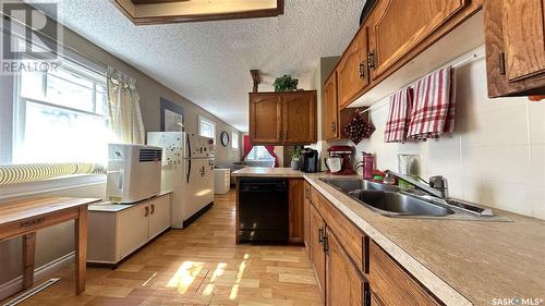 134 J Avenue S, Saskatoon, SK - Indoor Photo Showing Kitchen With Double Sink