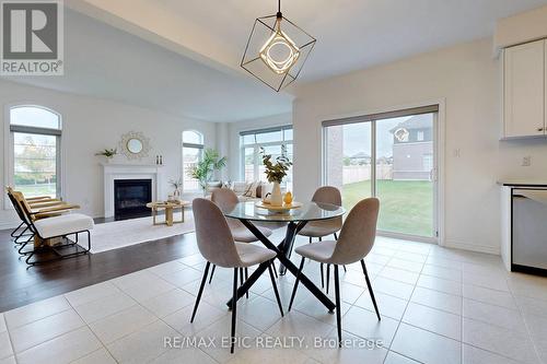 1 Kenneth Ross Bend, East Gwillimbury, ON - Indoor Photo Showing Dining Room With Fireplace