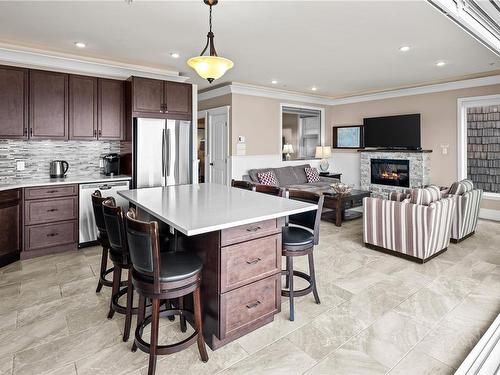 42B-1000 Sookepoint Pl, Sooke, BC - Indoor Photo Showing Kitchen With Fireplace With Upgraded Kitchen