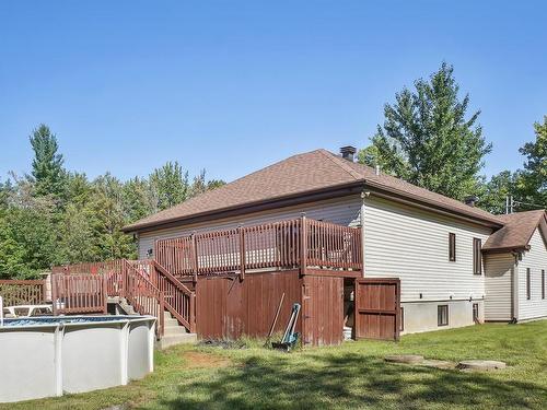 Backyard - 113  - 113A Rue Luc, Saint-Colomban, QC - Outdoor With Above Ground Pool