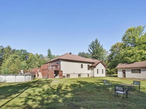 Back facade - 113  - 113A Rue Luc, Saint-Colomban, QC - Outdoor With Backyard