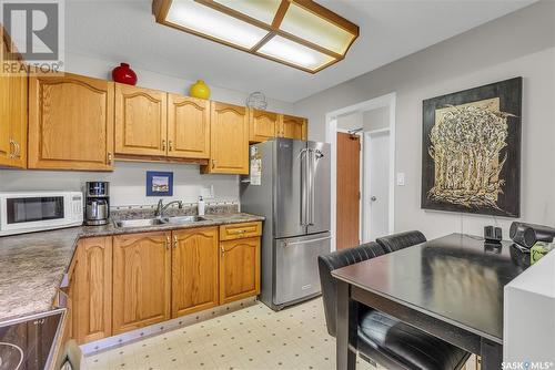 210 217A Cree Place, Saskatoon, SK - Indoor Photo Showing Kitchen With Double Sink