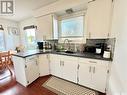 1055 3Rd Street E, Prince Albert, SK  - Indoor Photo Showing Kitchen With Double Sink 