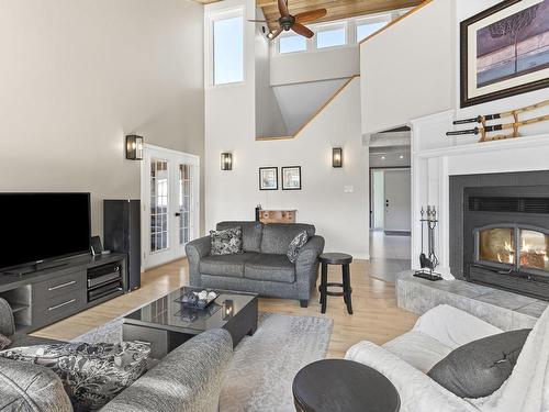 Salon - 68 Ch. Du Lac-Bertrand, Saint-Hippolyte, QC - Indoor Photo Showing Living Room With Fireplace