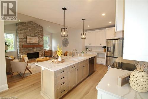 694 17Th St Crescent, Hanover, ON - Indoor Photo Showing Kitchen With Fireplace