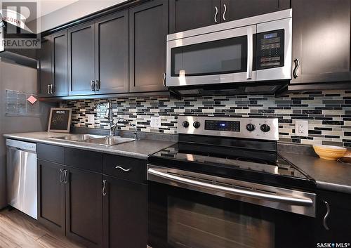 2 697 Sun Valley Drive, Estevan, SK - Indoor Photo Showing Kitchen With Double Sink