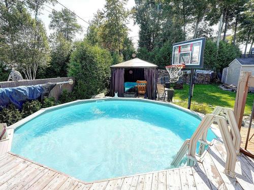 Cour - 1143 Rue De La Concorde, Saint-Jérôme, QC - Outdoor With Above Ground Pool With Deck Patio Veranda With Backyard