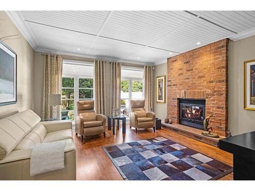 Family room - 7 Rue De Rambouillet, Blainville, QC - Indoor Photo Showing Living Room With Fireplace