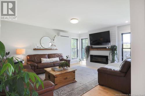 7 Patsy Street, Nauwigewauk, NB - Indoor Photo Showing Living Room With Fireplace