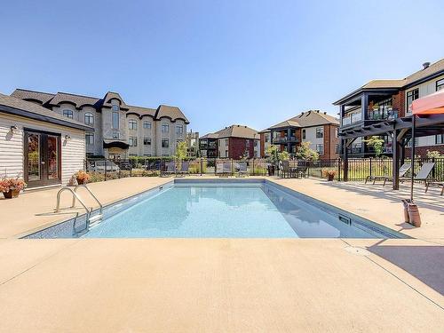 Piscine - 301-2215 Place Des Tilleuls, Saint-Bruno-De-Montarville, QC - Outdoor With In Ground Pool