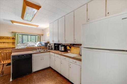 1955 Eastview Street, Fruitvale, BC - Indoor Photo Showing Kitchen With Double Sink