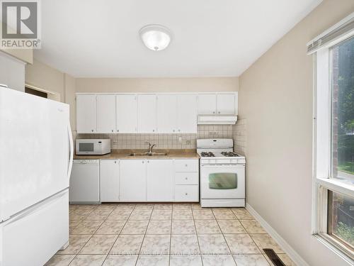 49 - 3665 Flamewood Drive, Mississauga, ON - Indoor Photo Showing Kitchen With Double Sink