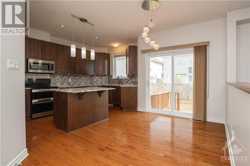 Eat-in kitchen with patio doors to large backyard - 107 Mangrove Crescent, Ottawa, ON - Indoor Photo Showing Kitchen With Upgraded Kitchen