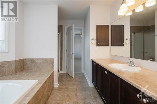 Large soaker tub, stand-alone shower with so much storage! - 107 Mangrove Crescent, Ottawa, ON - Indoor Photo Showing Bathroom