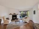 206-420 Parry St, Victoria, BC  - Indoor Photo Showing Living Room With Fireplace 