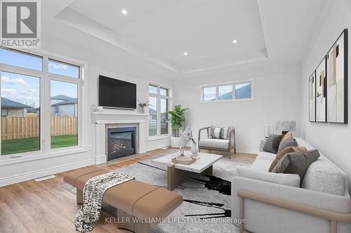 Virtually Staged - 112 Leneve Street, Lambton Shores (Forest), ON - Indoor Photo Showing Living Room With Fireplace