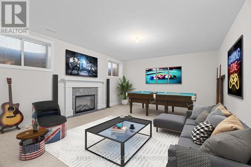 Virtually Staged - 112 Leneve Street, Lambton Shores (Forest), ON - Indoor Photo Showing Living Room With Fireplace