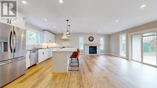 1559 Elmtree Drive, North Middlesex (Parkhill), ON - Indoor Photo Showing Kitchen With Fireplace With Stainless Steel Kitchen With Upgraded Kitchen