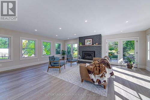 1680 Hwy 26, Springwater, ON - Indoor Photo Showing Other Room With Fireplace