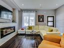 235 Bain Ave, Toronto, ON  - Indoor Photo Showing Living Room With Fireplace 