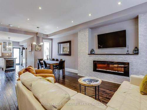 235 Bain Ave, Toronto, ON - Indoor Photo Showing Living Room With Fireplace