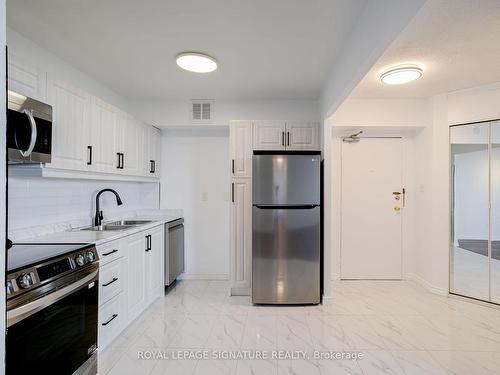 2605-380 Dixon Rd, Toronto, ON - Indoor Photo Showing Kitchen With Double Sink