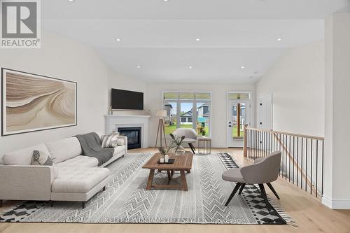 Virtually Staged - 110 Leneve Street, Lambton Shores (Forest), ON - Indoor Photo Showing Living Room With Fireplace