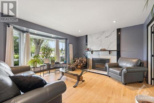 2376 Ogilvie Road, Ottawa, ON - Indoor Photo Showing Living Room With Fireplace