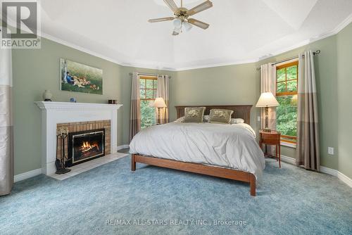 11 Aneva Court, Kawartha Lakes, ON - Indoor Photo Showing Bedroom With Fireplace