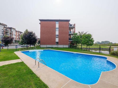 Pool - 111-100 Av. Du Golf, La Prairie, QC - Outdoor With In Ground Pool With Backyard