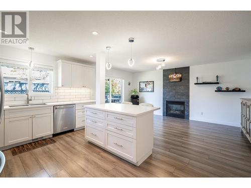 294 Marigold Road, Kelowna, BC - Indoor Photo Showing Kitchen With Fireplace With Upgraded Kitchen