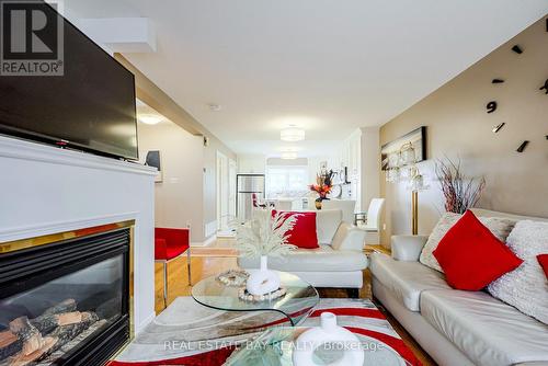 12 - 1735 Walnut Lane, Pickering (Town Centre), ON - Indoor Photo Showing Living Room With Fireplace