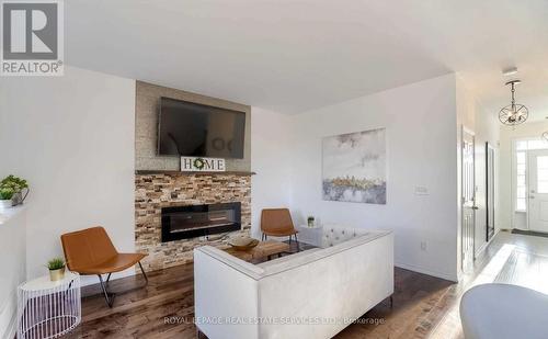 67 - 651 Farmstead Drive, Milton (Willmott), ON - Indoor Photo Showing Living Room With Fireplace