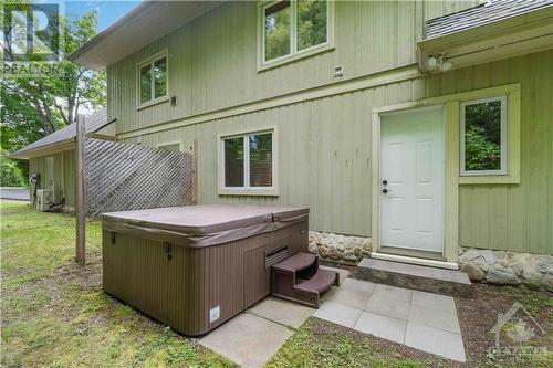 Off the second foyer is a hot tub, very private. - 698 Moffat Street, Pembroke, ON - Outdoor With Exterior