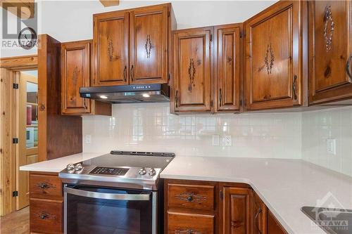 Quartz countertops and custom pine cabinets. The appliances are new as well. - 698 Moffat Street, Pembroke, ON - Indoor Photo Showing Kitchen