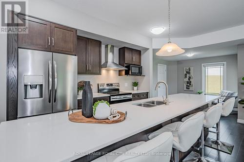 58 - 107 Westra Drive, Guelph/Eramosa, ON - Indoor Photo Showing Kitchen With Double Sink