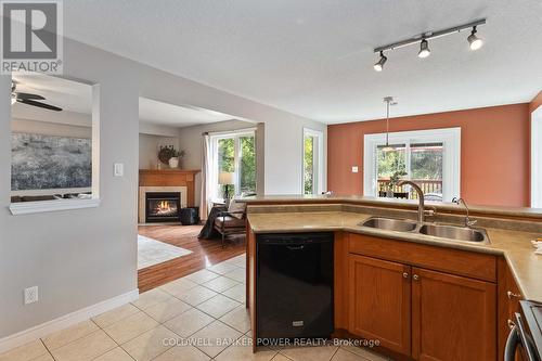 1748 Creekside Street, London, ON - Indoor Photo Showing Kitchen With Fireplace With Double Sink