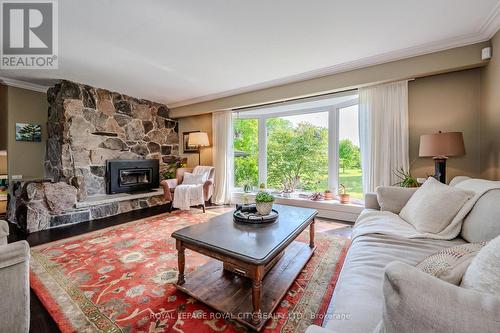 940 Watson Road, Puslinch, ON - Indoor Photo Showing Living Room With Fireplace