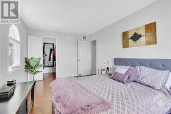 Primary bedroom with palladium window and walk-in-closet - 