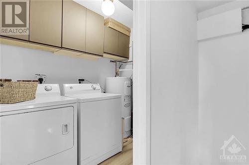 Laundry conveniently located on 2nd floor (wall unit AC in stairway installed 2020) - 1014 Tanguay Court, Ottawa, ON - Indoor Photo Showing Laundry Room