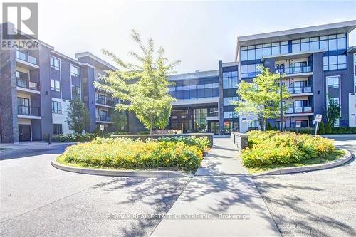 231 - 3170 Erin Mills Parkway, Mississauga, ON - Outdoor With Balcony With Facade