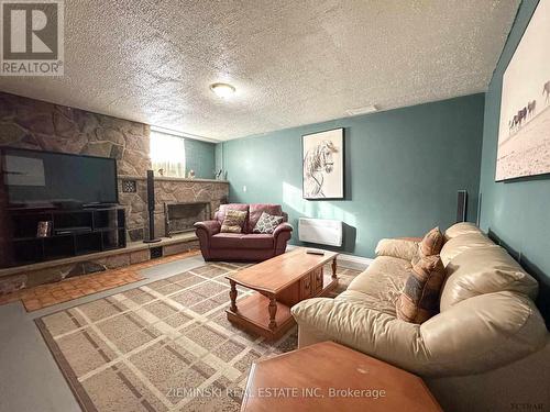 367 Timmins Avenue, Black River-Matheson, ON - Indoor Photo Showing Living Room With Fireplace