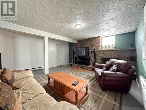 367 Timmins Avenue, Black River-Matheson, ON - Indoor Photo Showing Living Room With Fireplace